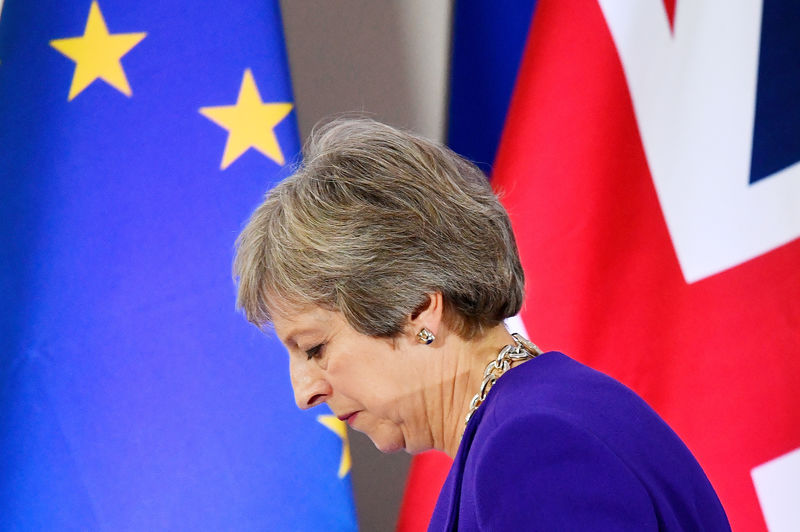 © Reuters. FILE PHOTO: Britain's Prime Minister Theresa May leaves a news conference at the European Union leaders summit in Brussels