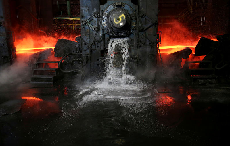 © Reuters. Water flows out as a steel slab is cooled at the Novolipetsk Steel PAO steel mill in Farrell