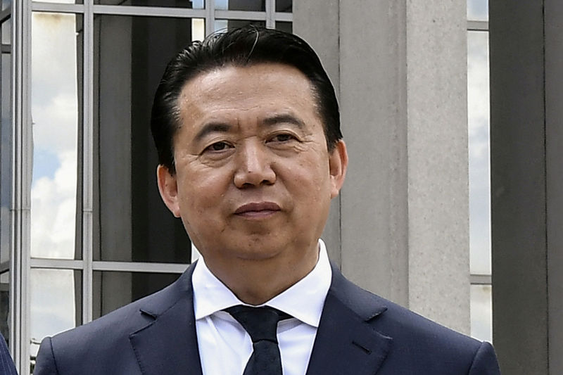 © Reuters. FILE PHOTO: INTERPOL President Meng Hongwei poses during a visit to the headquarters of International Police Organisation in Lyon
