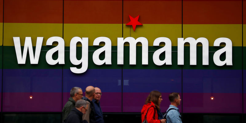 © Reuters. People walk past a branch of restaurant chain Wagamama in Manchester