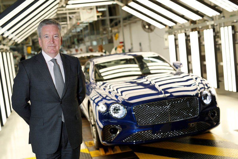 © Reuters. Chairman and CEO of Bentley Motors Adrian Hallmark poses at manufacturing facility in Crewe