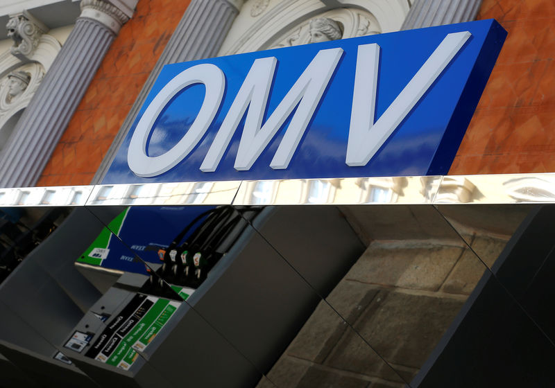 © Reuters. The logo of Austrian oil and gas group OMV is seen above a canopy in which a petrol pump is reflected at a gas station in Vienna