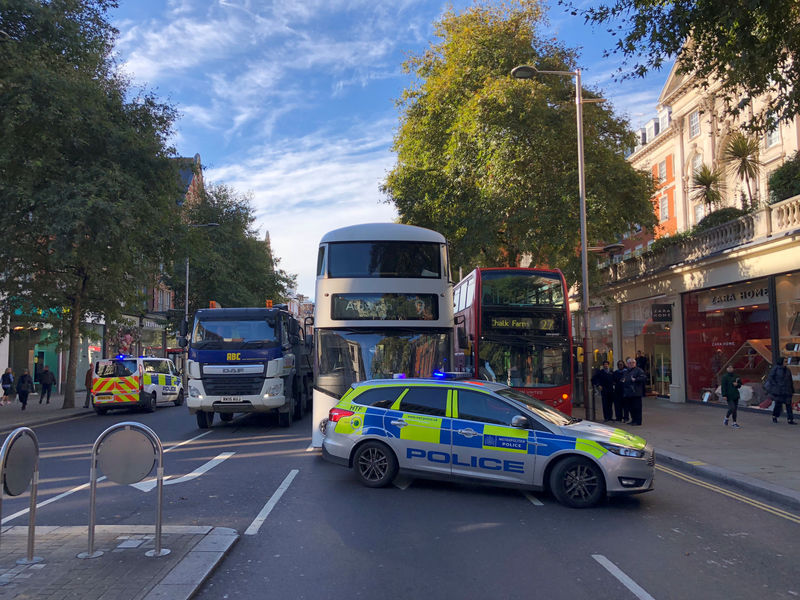 © Reuters. Police cars are seeen in central London