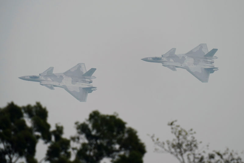 © Reuters. J-20 stealth fighters of Chinese People's Liberation Army Air Force (PLAAF)  are seen during a test flight ahead of Zhuhai Airshow