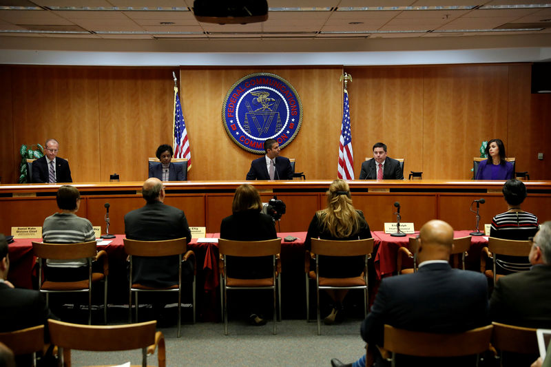 © Reuters. FILE PHOTO: Chairman Ajit Pai leads a vote on the repeal of so called net neutrality rules at the Federal Communications Commission in Washington