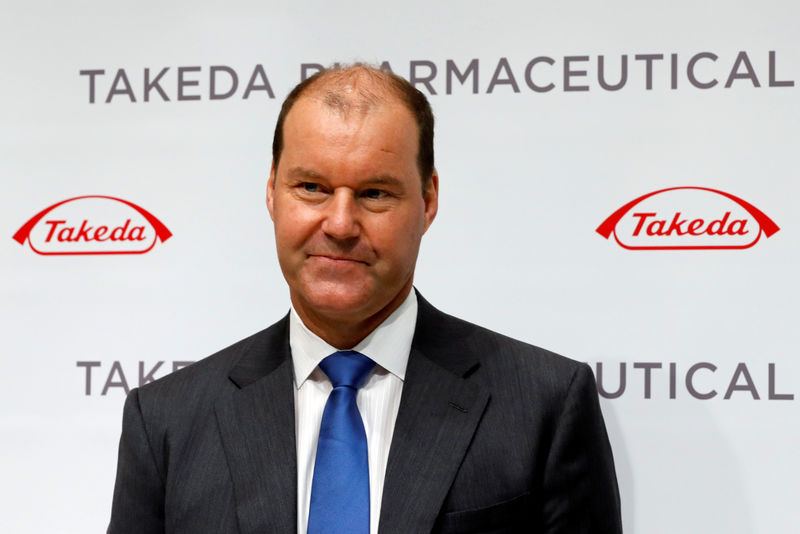 © Reuters. FILE PHOTO - Takeda Pharmaceutical Co President and Chief Executive Officer Christophe Weber attends an opening ceremony for its new headquarters in Tokyo