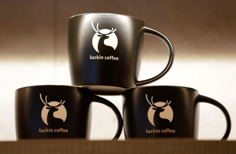 © Reuters. Logos are seen on the cups for sale at a Luckin Coffee store in Beijing