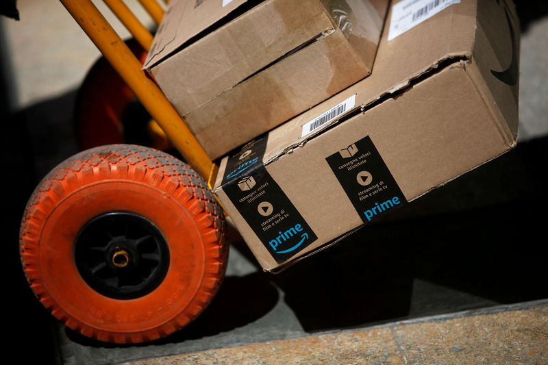 © Reuters. FILE PHOTO: An Amazon box is seen on a cart before being delivered by a Correos Express delivery worker in downtown Ronda