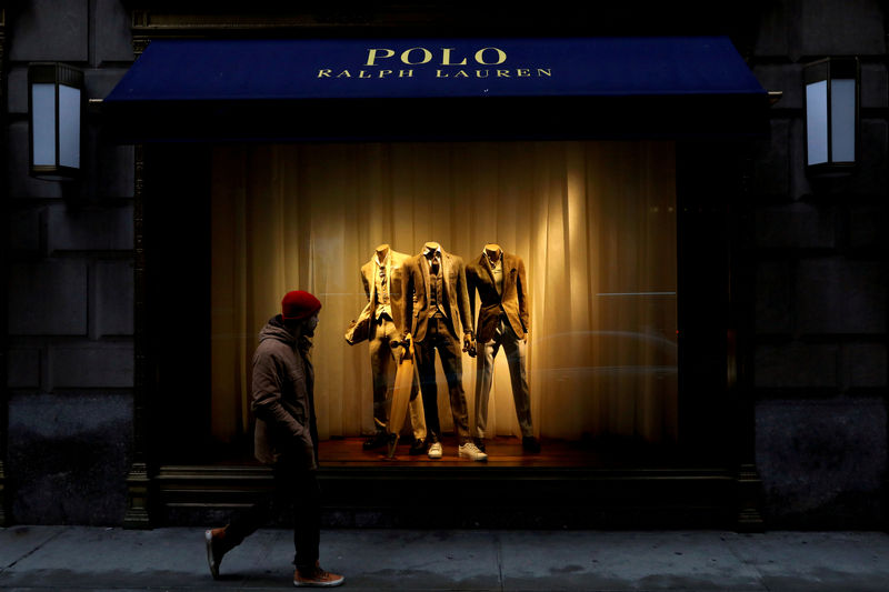 © Reuters. FILE PHOTO: A man walks past Ralph Lauren Corp.'s  flagship Polo store on Fifth Avenue in New York