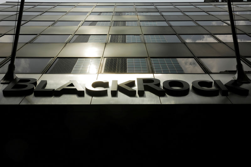 © Reuters. FILE PHOTO: A sign for BlackRock Inc hangs above their building in New York