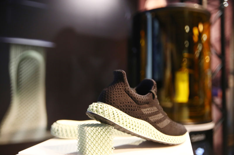 © Reuters. A pair of the sport shoes of Adidas, printed by 3D printer, is seen before the company's annual news conference in Herzogenaurach