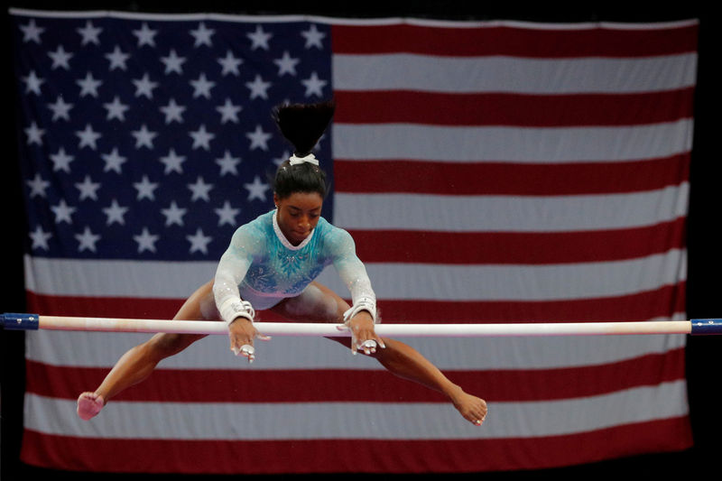 © Reuters. FILE PHOTO: Simone Biles competes on uneven bars at the U.S. Gymnastics Championships in Boston
