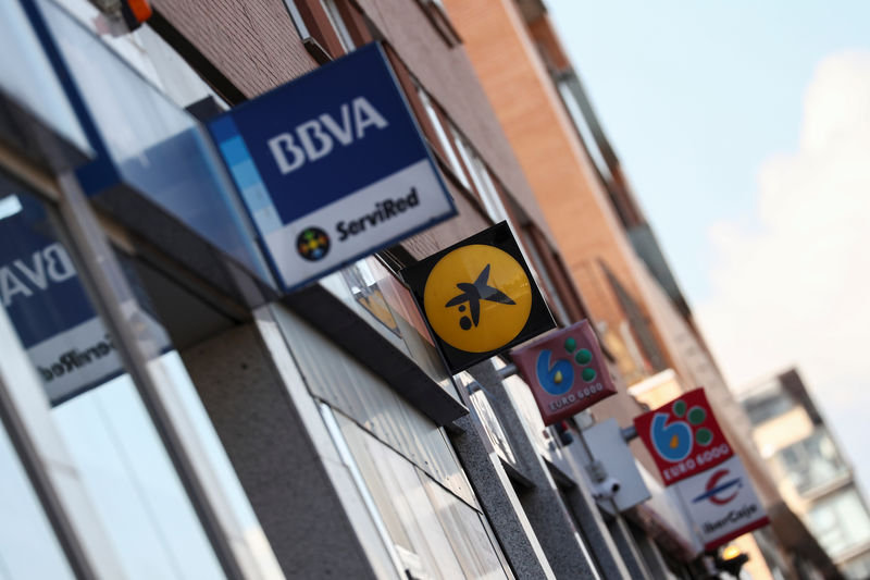 © Reuters. Bank signs are seen on buildings on a street in Madrid