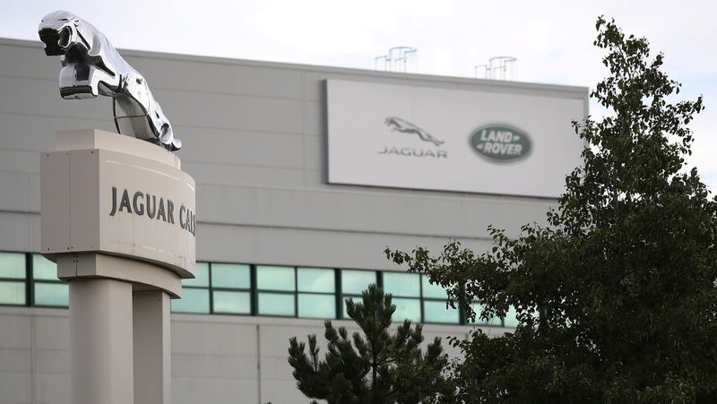 © Reuters. FILE PHOTO: Signs are seen outside the Jaguar Land Rover plant at Halewood in Liverpool, northern England
