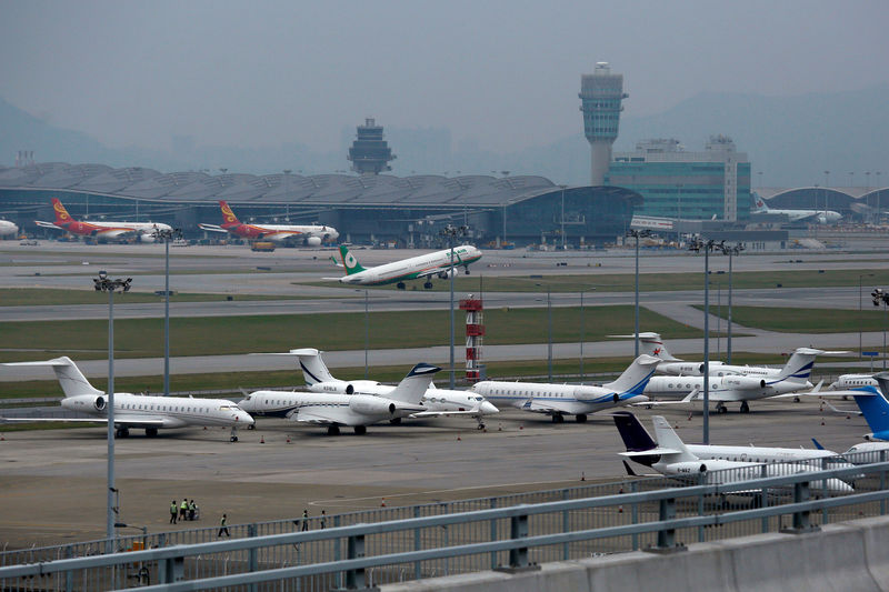 © Reuters. Business jets park at Hong Kong International Airport