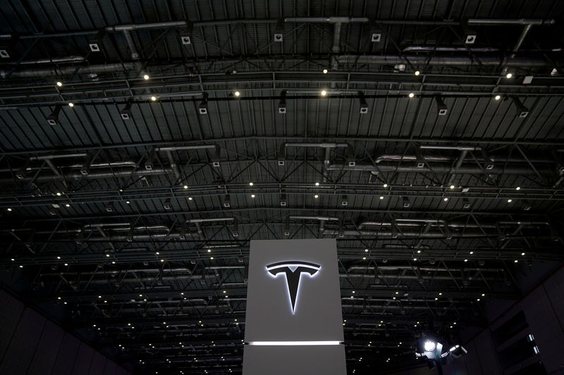 © Reuters. FILE PHOTO: A Tesla sign is seen during the China International Import Expo (CIIE), at the National Exhibition and Convention Center in Shanghai