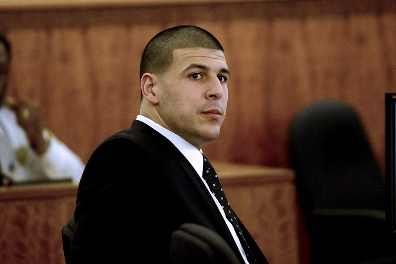 © Reuters. FILE PHOTO:  Former New England Patriots tight end Aaron Hernandez sits during his murder trial at Bristol County Superior Court in Fall River