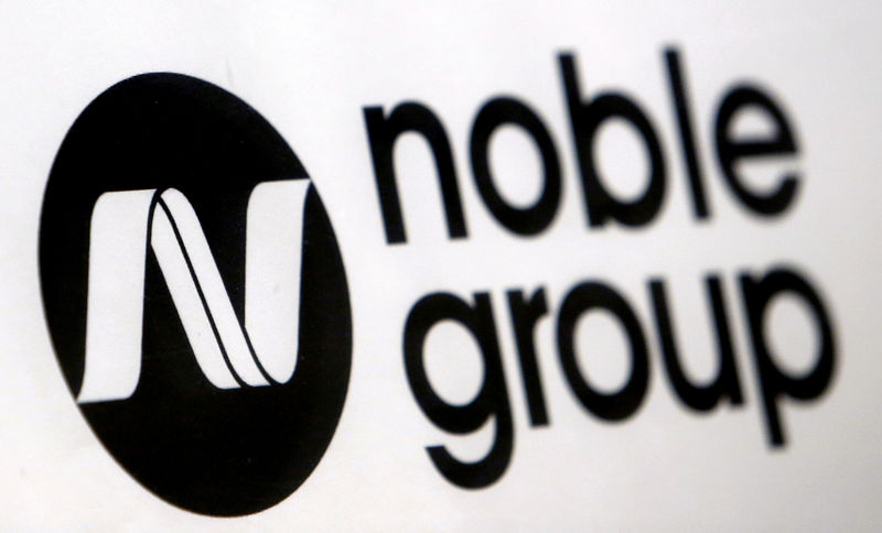 © Reuters. FILE PHOTO: A Noble Group sign is pictured at a meet-the-investors event in Singapore