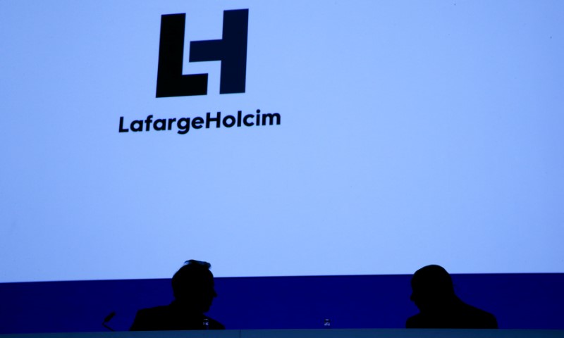 © Reuters. CEO Olsen and Chairman Hess of Franco-Swiss cement giant LafargeHolcim attend the company's annual shareholder meeting in Zurich