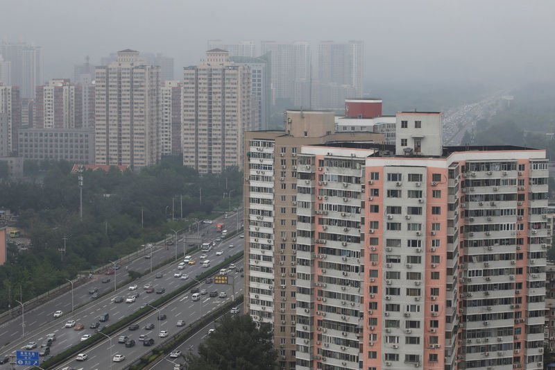 © Reuters. Residential buildings are seen along the Fourth Ring Road in Beijing