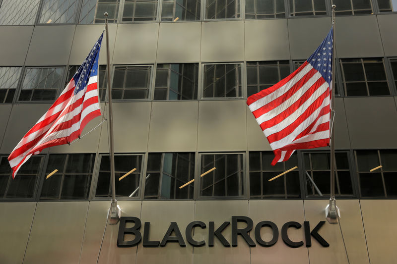 © Reuters. FILE PHOTO: FILE PHOTO: A sign for BlackRock Inc hangs above their building in New York