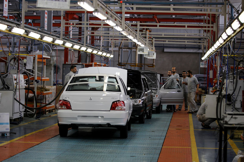 © Reuters. Cars are seen inside the Saipa Syria Factory in the industrial city of Hassia in Homs