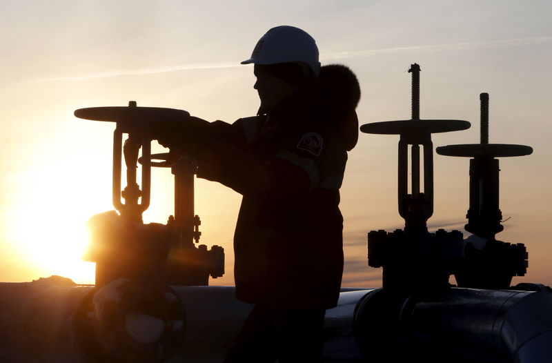 Oil prices stable on expected OPEC cuts, but surging U.S. supply drags