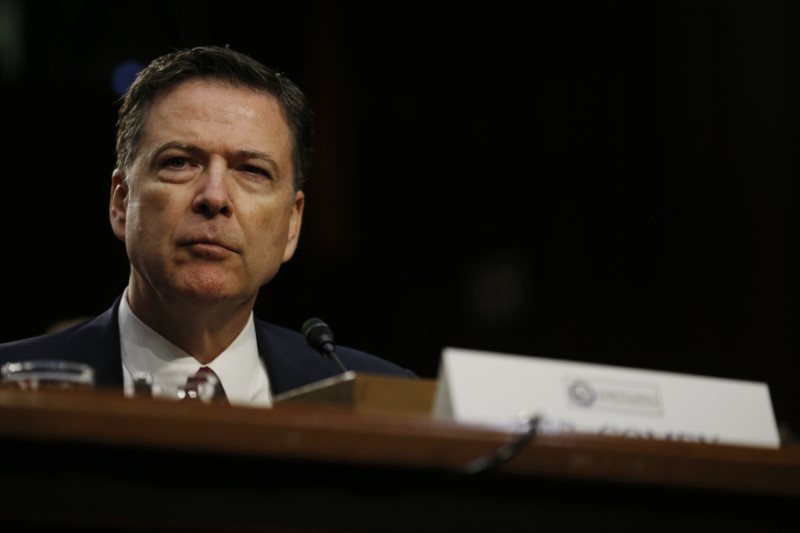 © Reuters. FILE PHOTO: Former FBI Director Comey testifies before a Senate Intelligence Committee hearing in Washington
