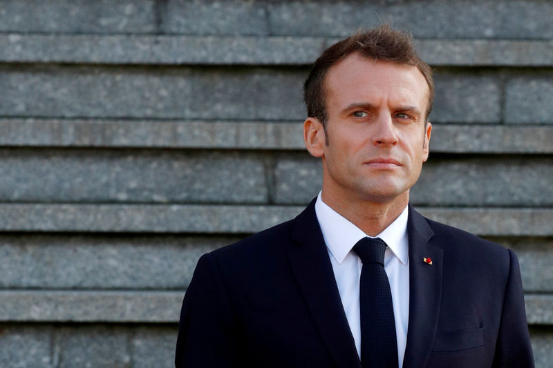 © Reuters. FILE PHOTO: French President Emmanuel Macron waits for the arrival of Britain's Prime Minister Theresa May before a meeting at the city hall in Albert