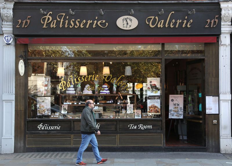 © Reuters. FILE PHOTO:  A man walks past a branch of Patisserie Valerie in London