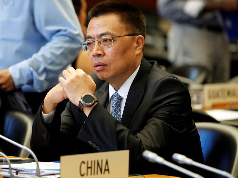© Reuters. Zhang Chinese Ambassador to the WTO looks on before the start of the General Council meeting in Geneva