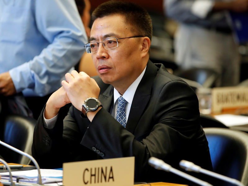 © Reuters. FILE PHOTO: Zhang Chinese Ambassador to the WTO looks on before the start of the General Council meeting in Geneva