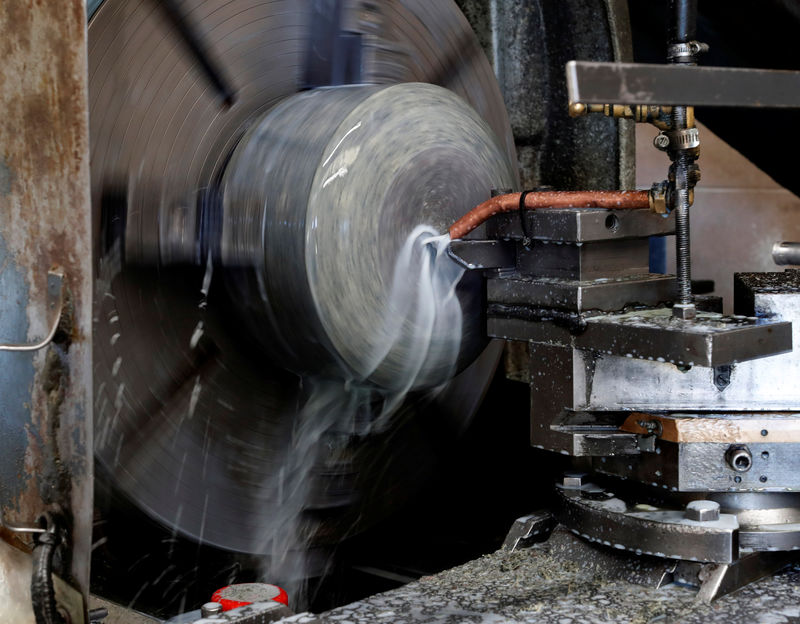 © Reuters. Granite is shaped on a lathe to make a curling stone in Kays Factory Mauchline, Scotland