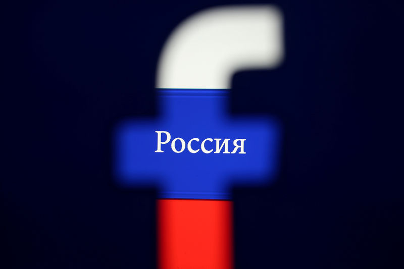 © Reuters. FILE PHOTO:  Photo illustration of a 3D printed Facebook logo seen in front of a displayed Russian flag