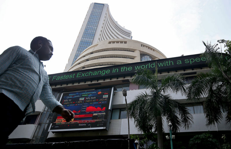 © Reuters. FILE PHOTO:  A man walks past the Bombay Stock Exchange (BSE) building in Mumbai