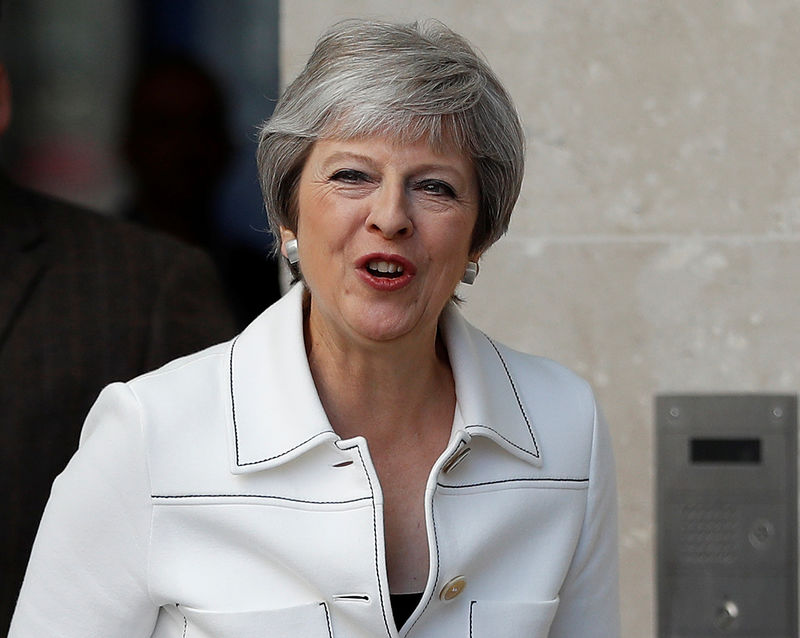 © Reuters. Britain's Prime Minister, Theresa May, leaves the BBC after appearing on the Andrew Marr Show, in central London