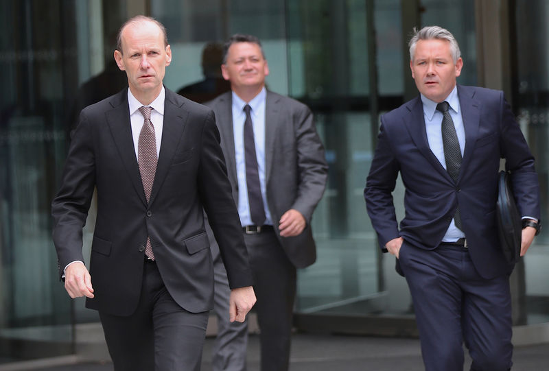 © Reuters. ANZ Chief Executive Elliott walks with officials out of the building where the Royal Commission inquiry into financial-sector misconduct is being held in Melbourne