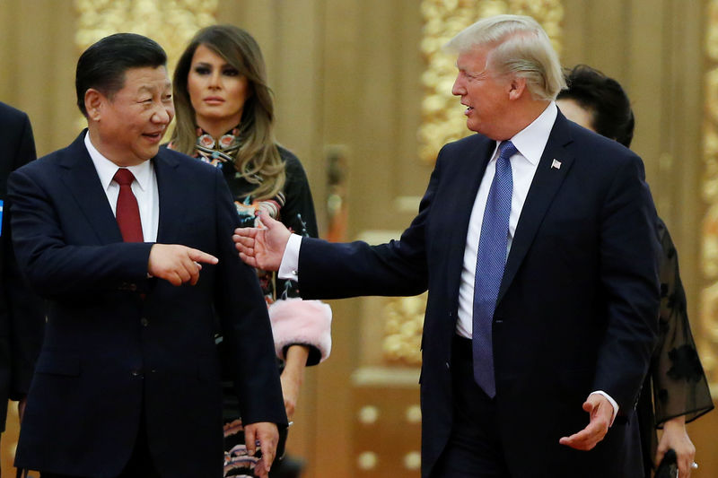 © Reuters. FILE PHOTO: U.S. President Donald Trump and China's President Xi Jinping arrive at a state dinner at the Great Hall of the People in Beijing