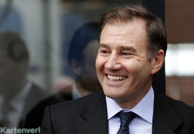 © Reuters. FILE PHOTO:  Glencore CEO Glasenberg smiles as he leaves after the company's annual shareholder meeting in Zug