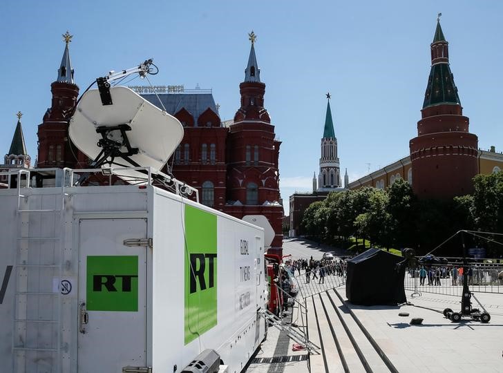 © Reuters. Vehicles of Russian state-controlled broadcaster Russia Today are seen near the Red Square in central Moscow