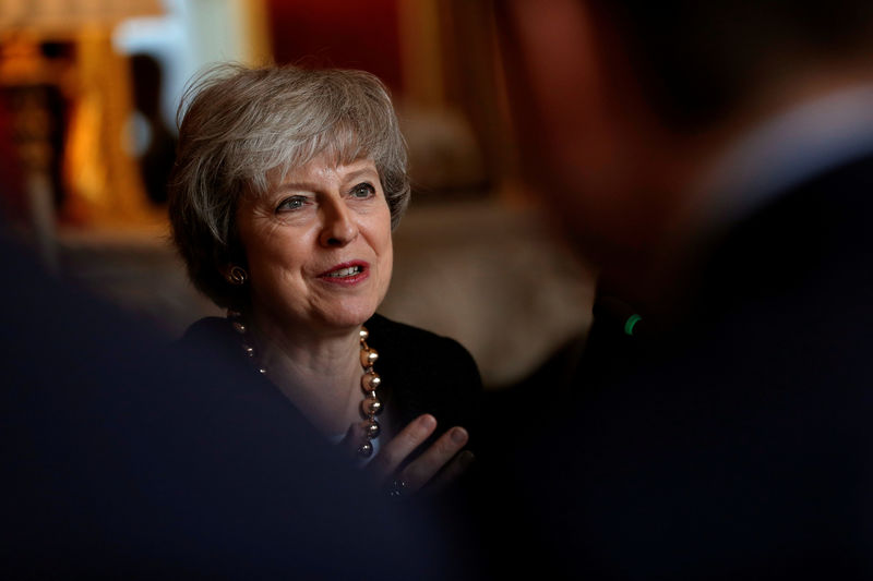 © Reuters. Britain's Prime Minister Theresa May sits with members of her cabinet during the UK-Poland Inter-Governmental Consultations at Lancaster House in central London