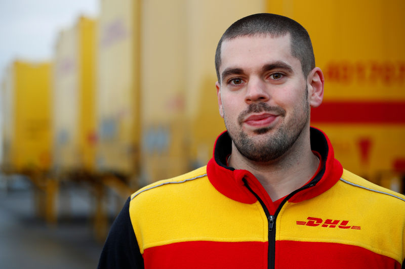© Reuters. Klankert, a 27-year-old truck driver of German postal and logistics group Deutsche Post DHL poses for a picture during a Reuters interview in Sehlem