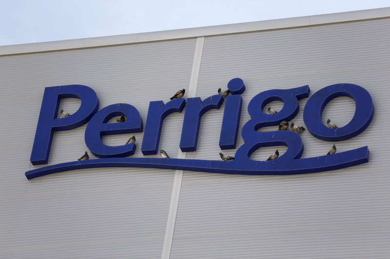 © Reuters. FILE PHOTO:  Birds are seen on the logo of generic drugmaker Perrigo Co outside their new factory in the city of Yeruham