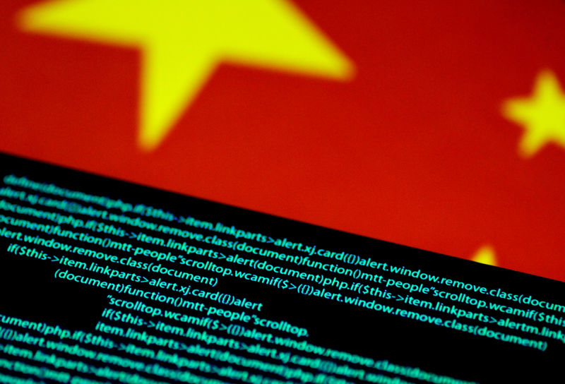 © Reuters. Illustration photo of computer code on a screen above a Chinese flag