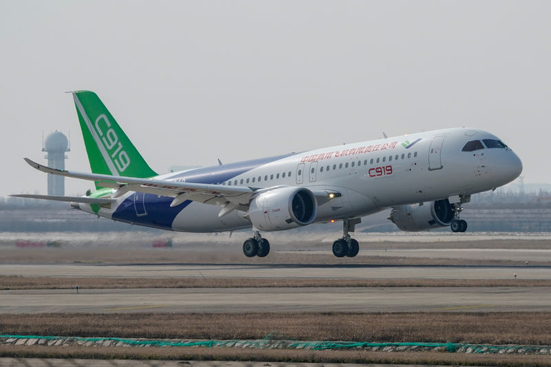© Reuters. The third prototype of China's home-built passenger jet C919 takes off during its first test flight at Shanghai Pudong International Airport