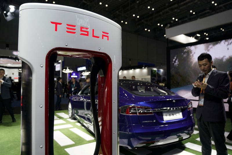 © Reuters. FILE PHOTO: A Tesla sign is seen during the China International Import Expo (CIIE), at the National Exhibition and Convention Center in Shanghai