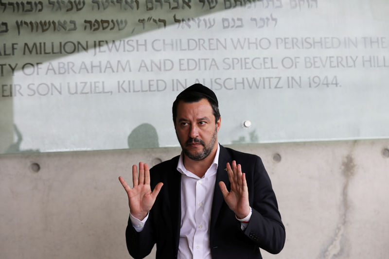© Reuters. FILE PHOTO: Italian Deputy Prime Minister and right-wing League party leader Matteo Salvini gestures as he speaks to members of the media during his visit to Yad Vashem World Holocaust Remembrance Center in Jerusalem