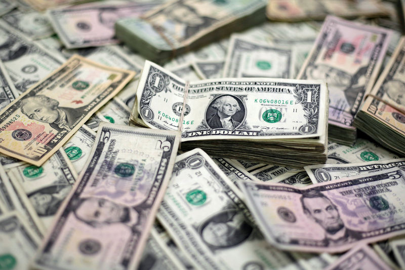© Reuters. U.S. Dollar banknotes are seen in this photo illustration