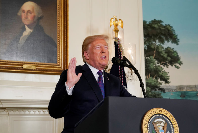 © Reuters. FILE PHOTO: U.S. President Trump announces military strikes on Syria while delivering a statement from the White House in Washington