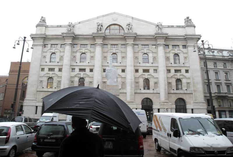 © Reuters. Man walks past Milan's stock exchange building in downtown Milan